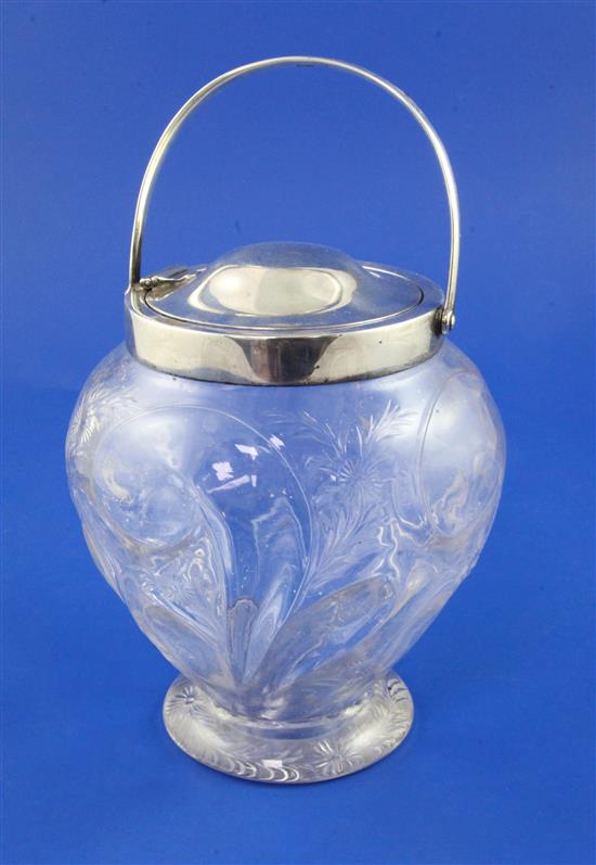 An Edwardian patent action silver mounted rock crystal glass biscuit barrel in the style of Stevens & Williams, 8.25in incl. handle.
